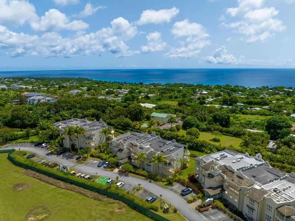 Aerial view of the Royal apartment buildings at Royal Westmoreland, Barbados, with the west coast and Caribbean Sea beyond