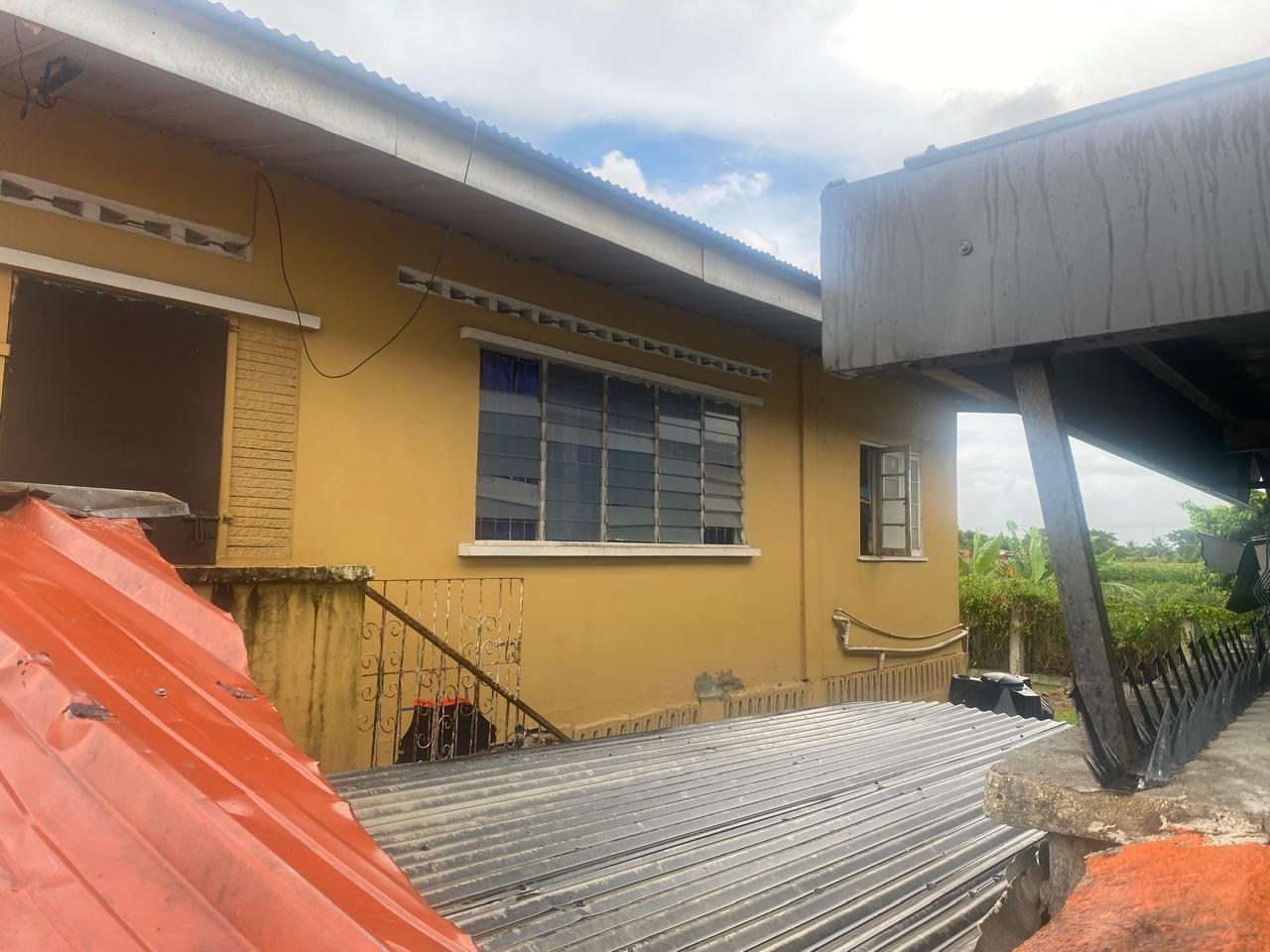 Prime Commercial Land with Free Fixer Upper Structures – Kelly Village, Trinidad — photo 2