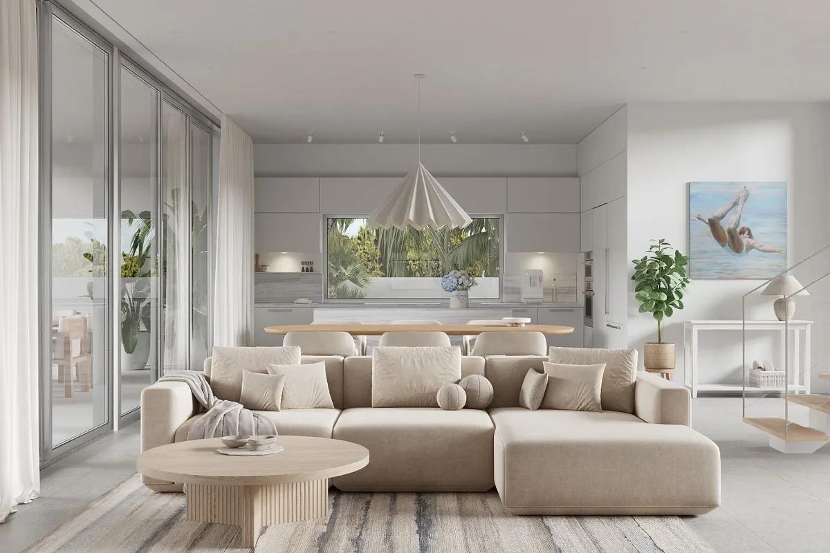 Artist’s rendering of a white living room with a deep sectional sofa and a hanging chair