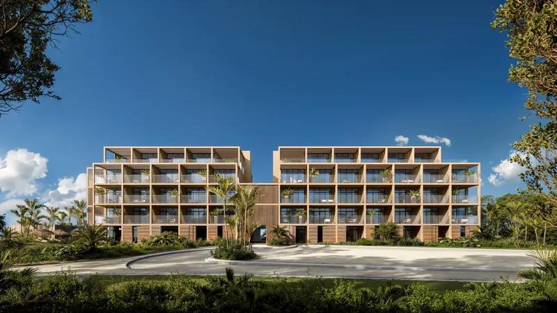 a timber-screened apartment building standing on open lawn