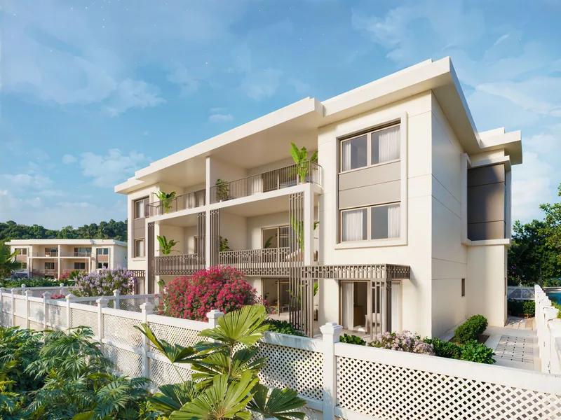 A modern three-storey apartment building with deep balconies and bougainvillea at its base
