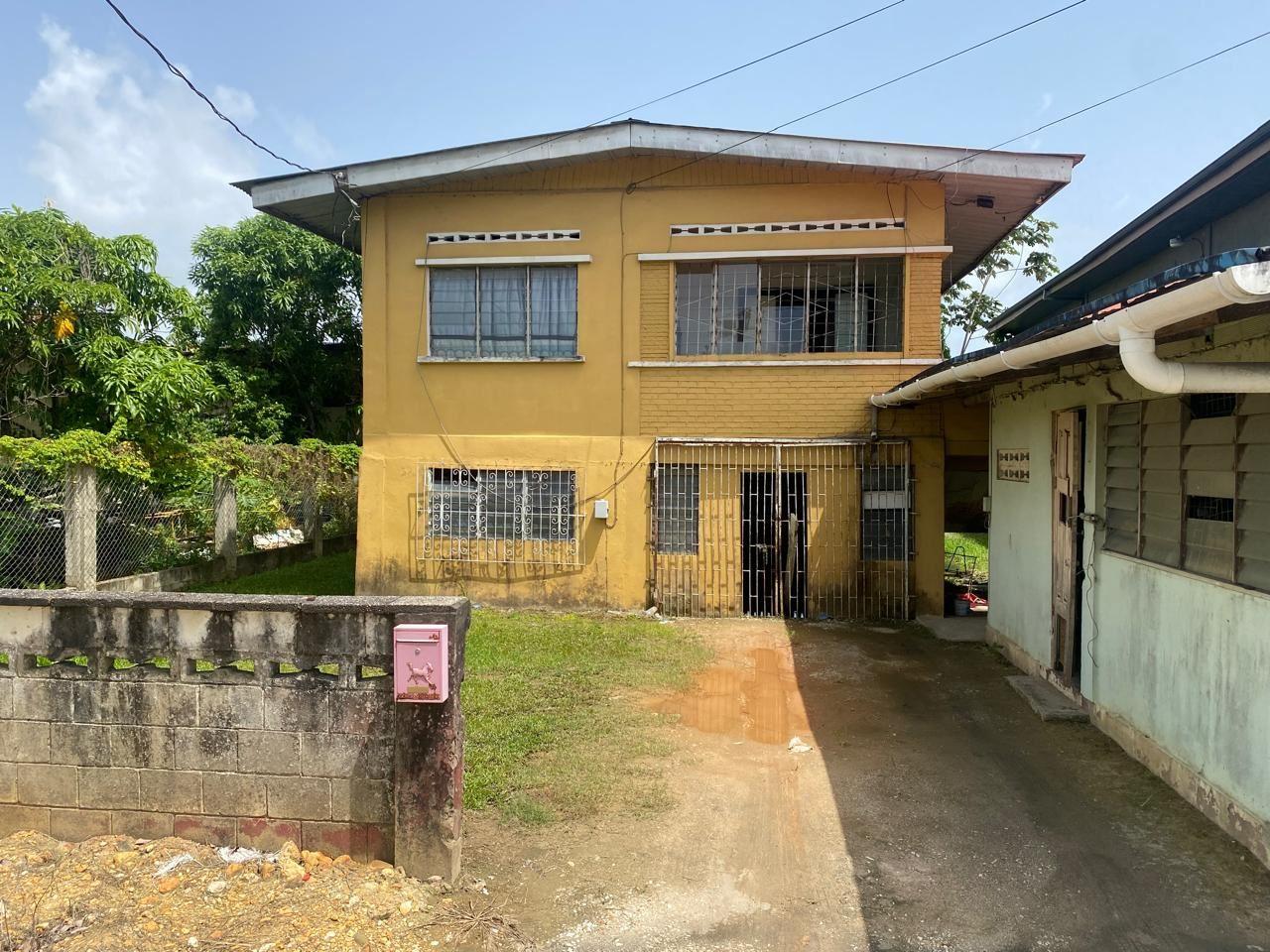 Prime Commercial Land with Free Fixer Upper Structures – Kelly Village, Trinidad — photo 1