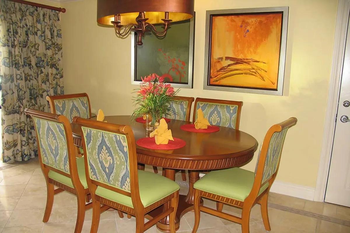 The dining table set for four beside the terrace door