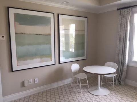 the living area, with a cafe table by the window