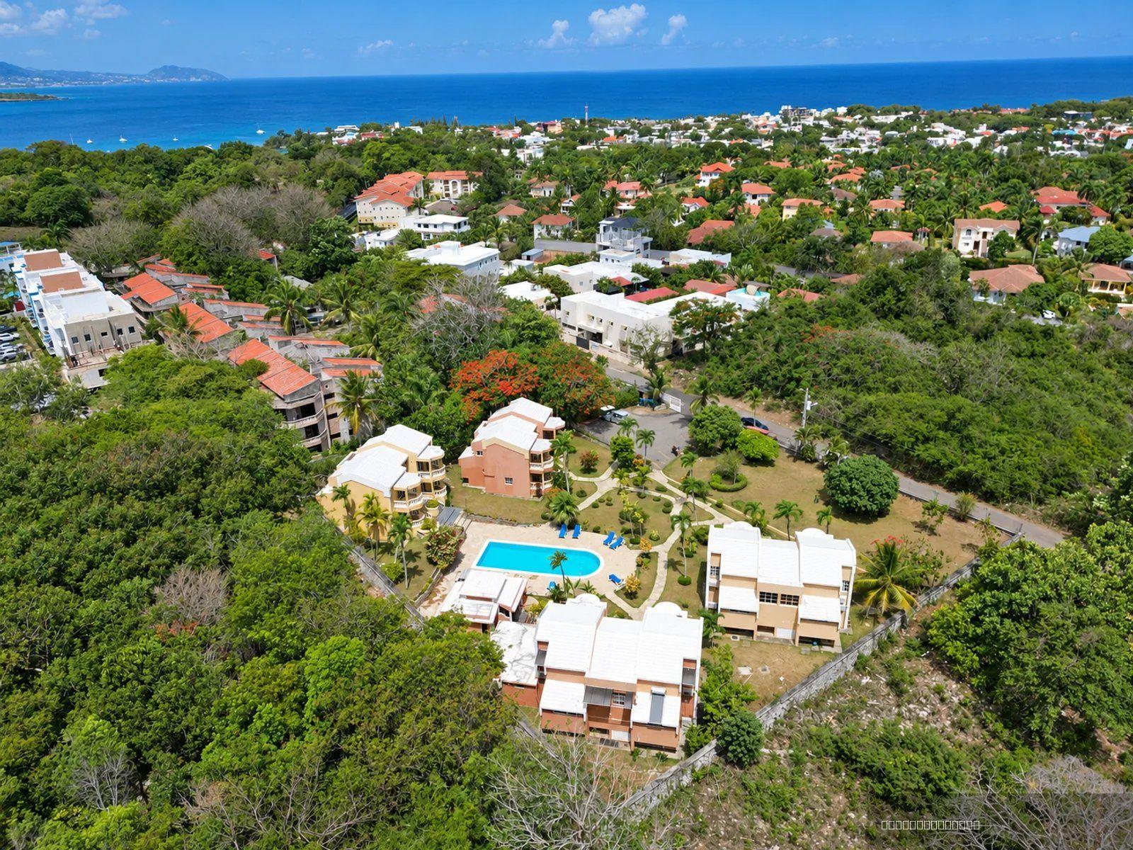 1-bedroom apartment in Sosua with two pool-view balconies — photo 1