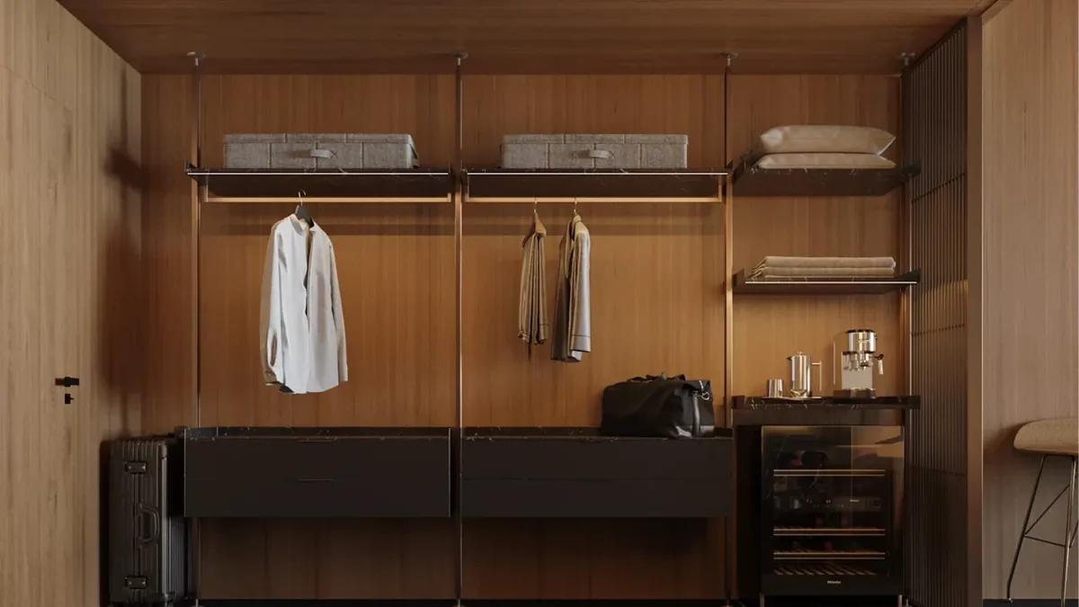 A timber-lined walk-in wardrobe with open hanging rails and folded linen on the shelves