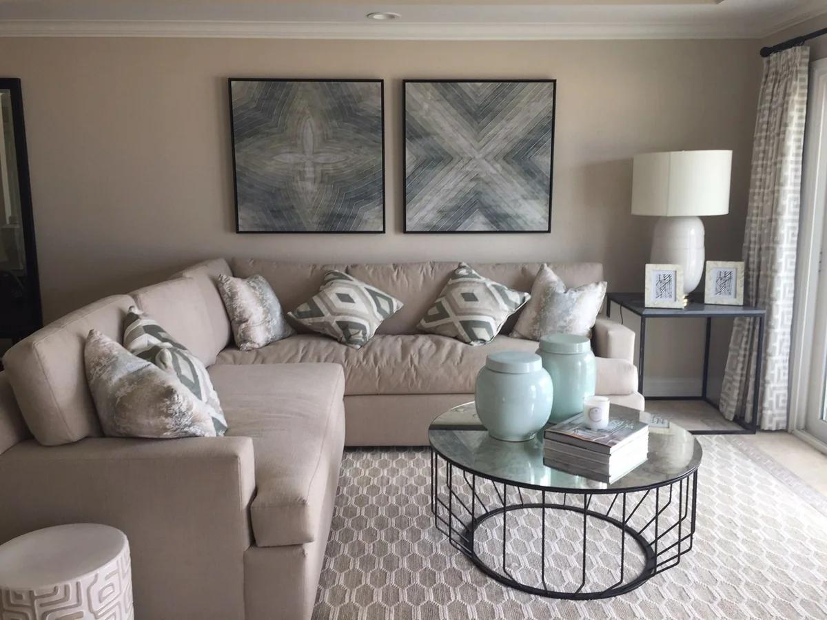 the living room, with a corner sectional and coffee table