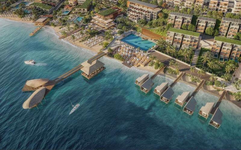Artist’s rendering of overwater bungalows on a jetty in front of a hillside resort, seen from the air